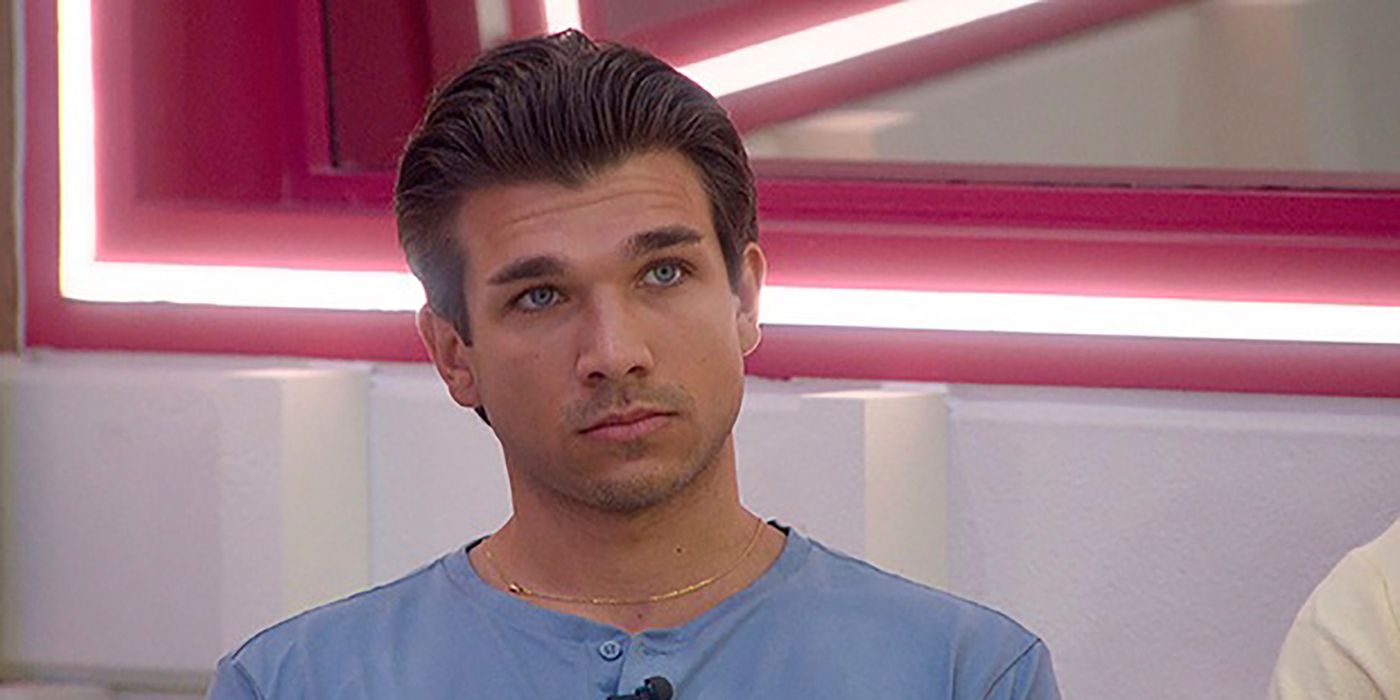 Joe "Pooch" from Big Brother sitting in the living room looking like a deer in headlights.