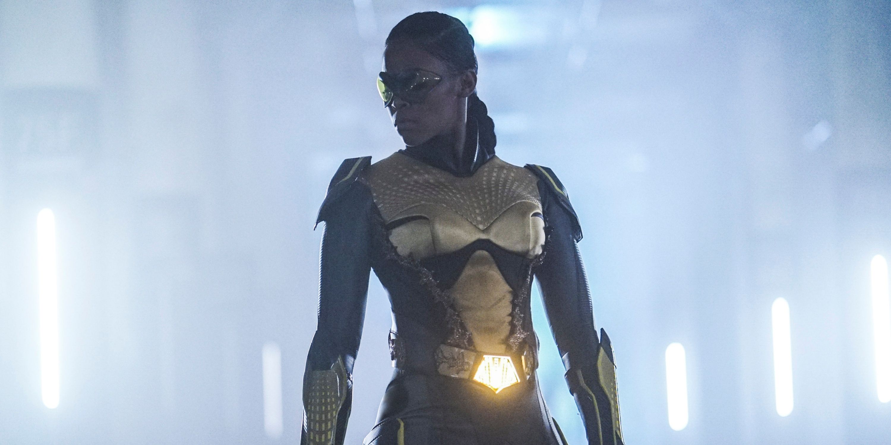 Nafessa Williams as Thunder in her superhero suit with her hair pulled back in braids in Black Lightning
