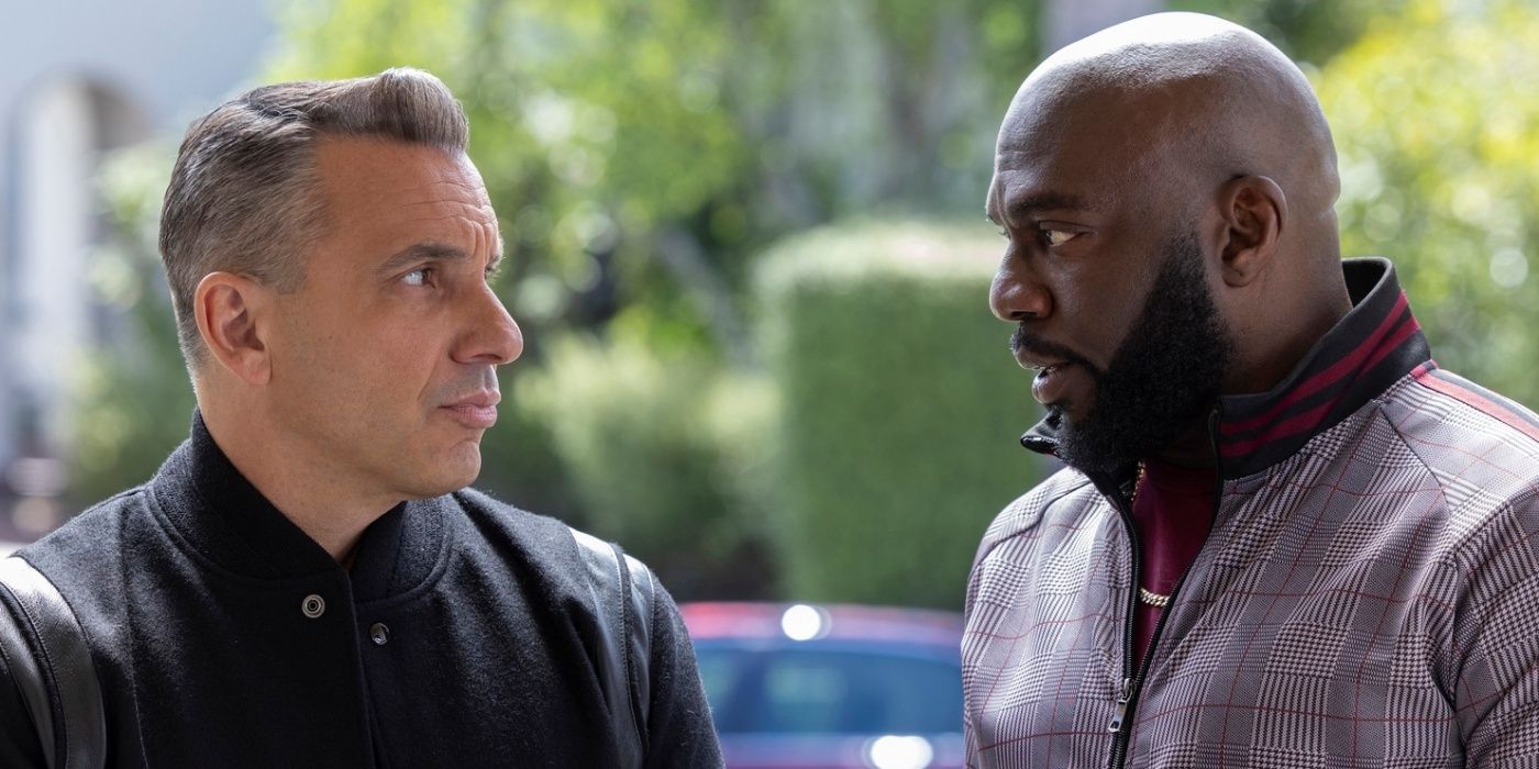 Sebastian Maniscalco as Danny and Omar J. Dorsey as Ray looking at each other in Season 2 of Bookie