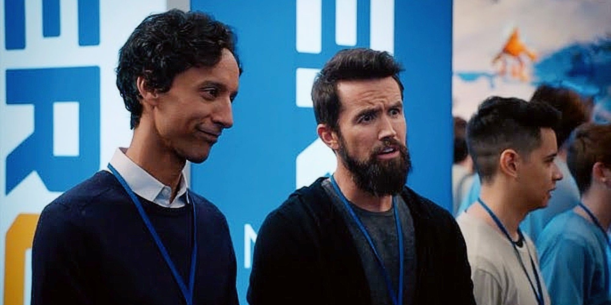Brad Bakshi and Ian Grimm standing together at a convention in Mythic Quest Season 1