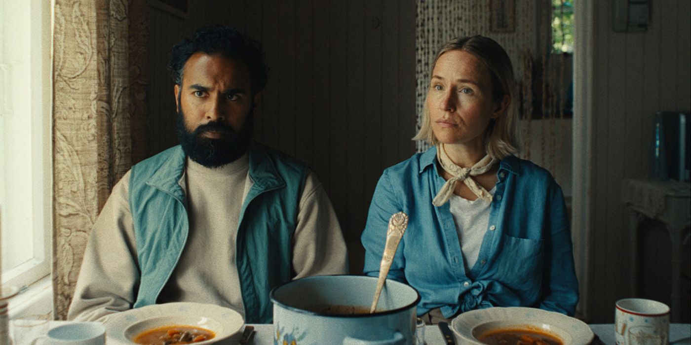 Declan (Himesh Patel) and Dolores (Sarah Goldberg) at a dining table looking perplexed in Bubble & Squeak