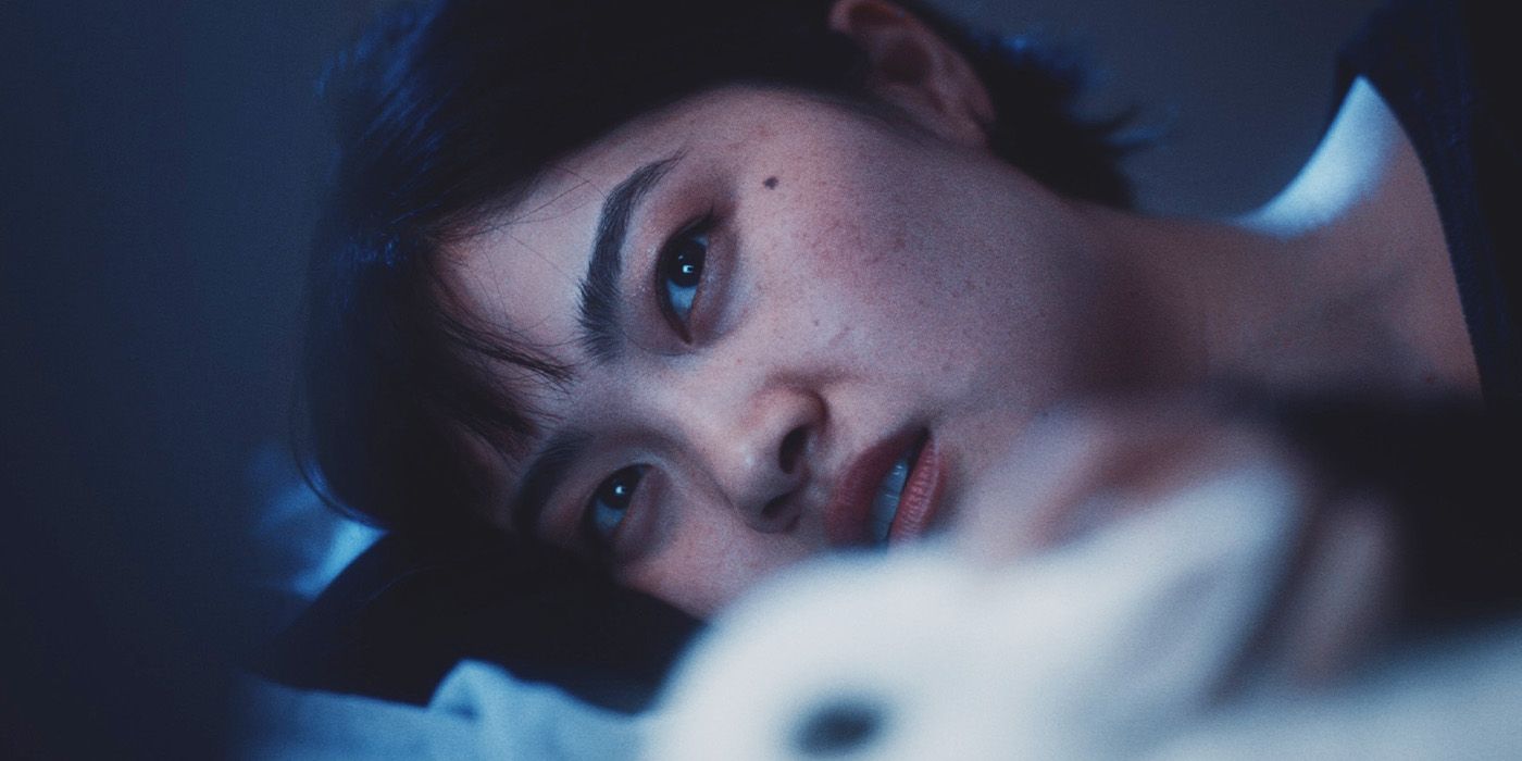 A close-up of Katarina Zhu lying down with a confused expression in Bunnylovr