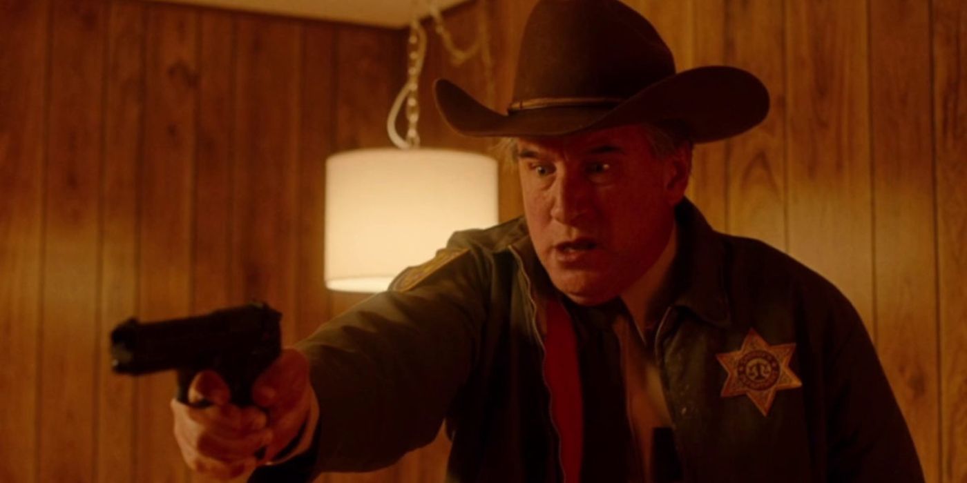 Sheriff Rex, portrayed by William Baldwin, points his gun at the killer.