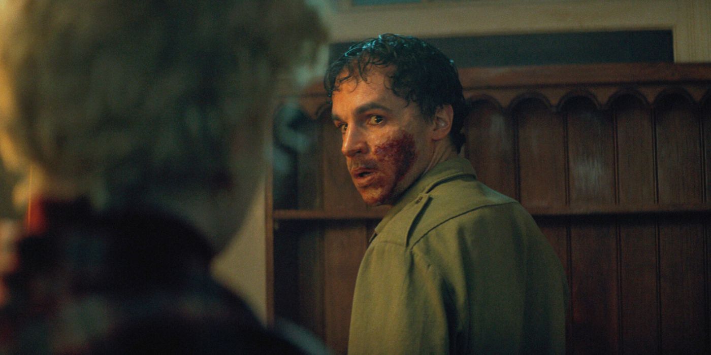 Christopher Abbott as Blake, with his face bloodied, in Wolf Man.