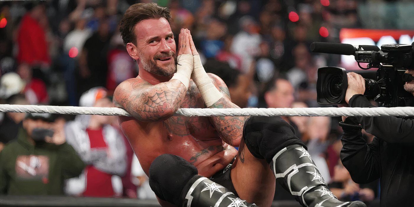 CM Punk celebrates his WWE Raw win over Seth Rollins