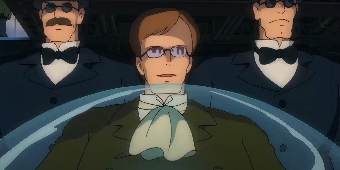 Colonel Muska sits ominously with two suited men on each side of him.