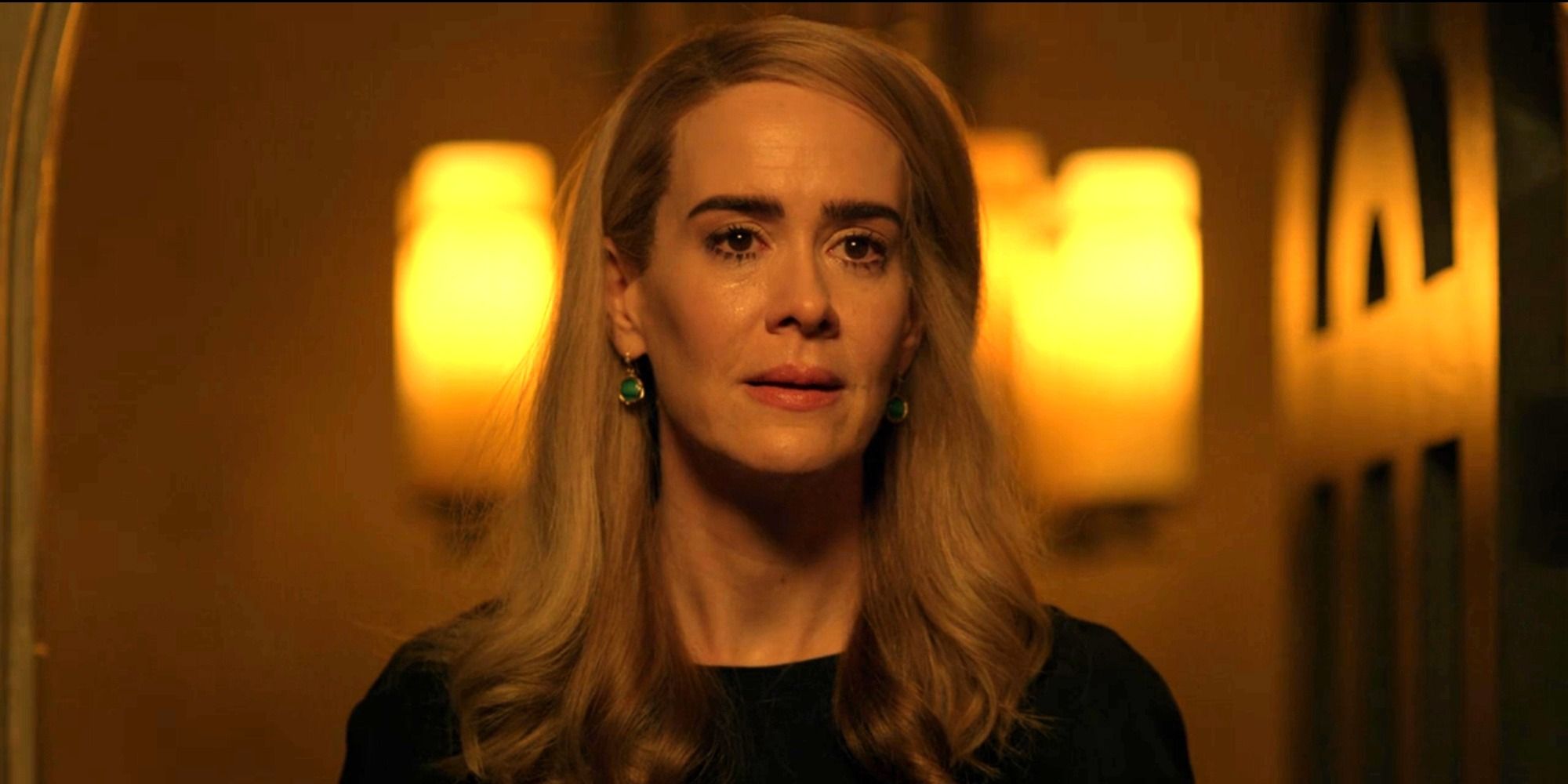 Cordelia Foxx (Sarah Paulson) standing in a dimly lit hallway &lsquo;American Horror Story: Apocalypse.'