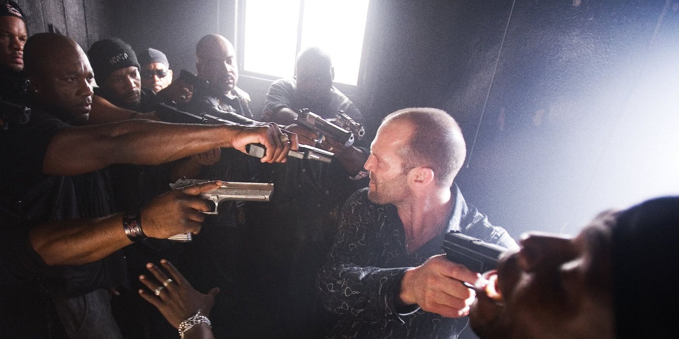 Jason Statham is held by multiple gunpoint by a gang in Crank (2006)