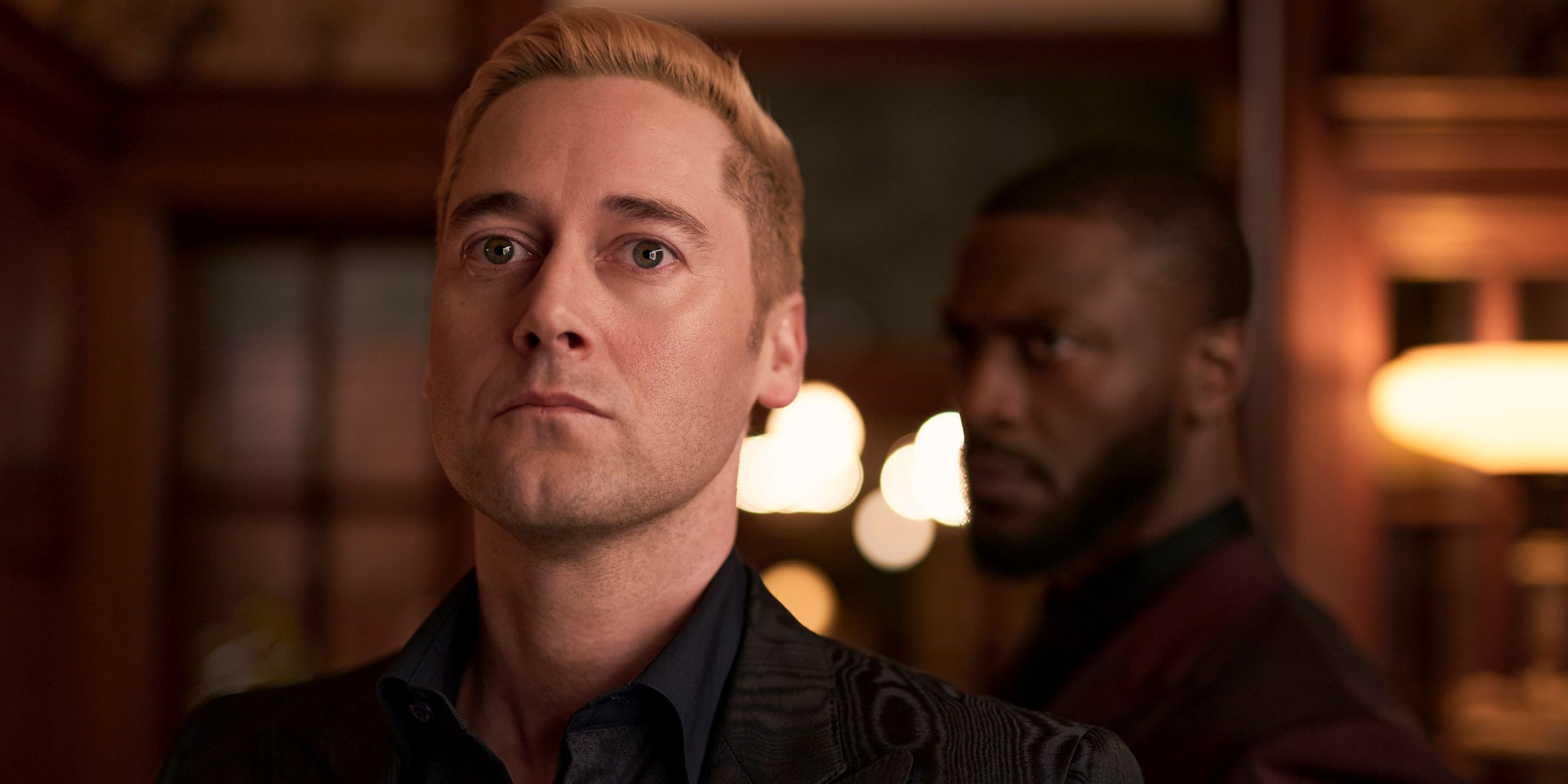 Ryan Eggold as Ed Ramsey looking serious while standing in front of Aldis Hodge as Alex Cross in Cross