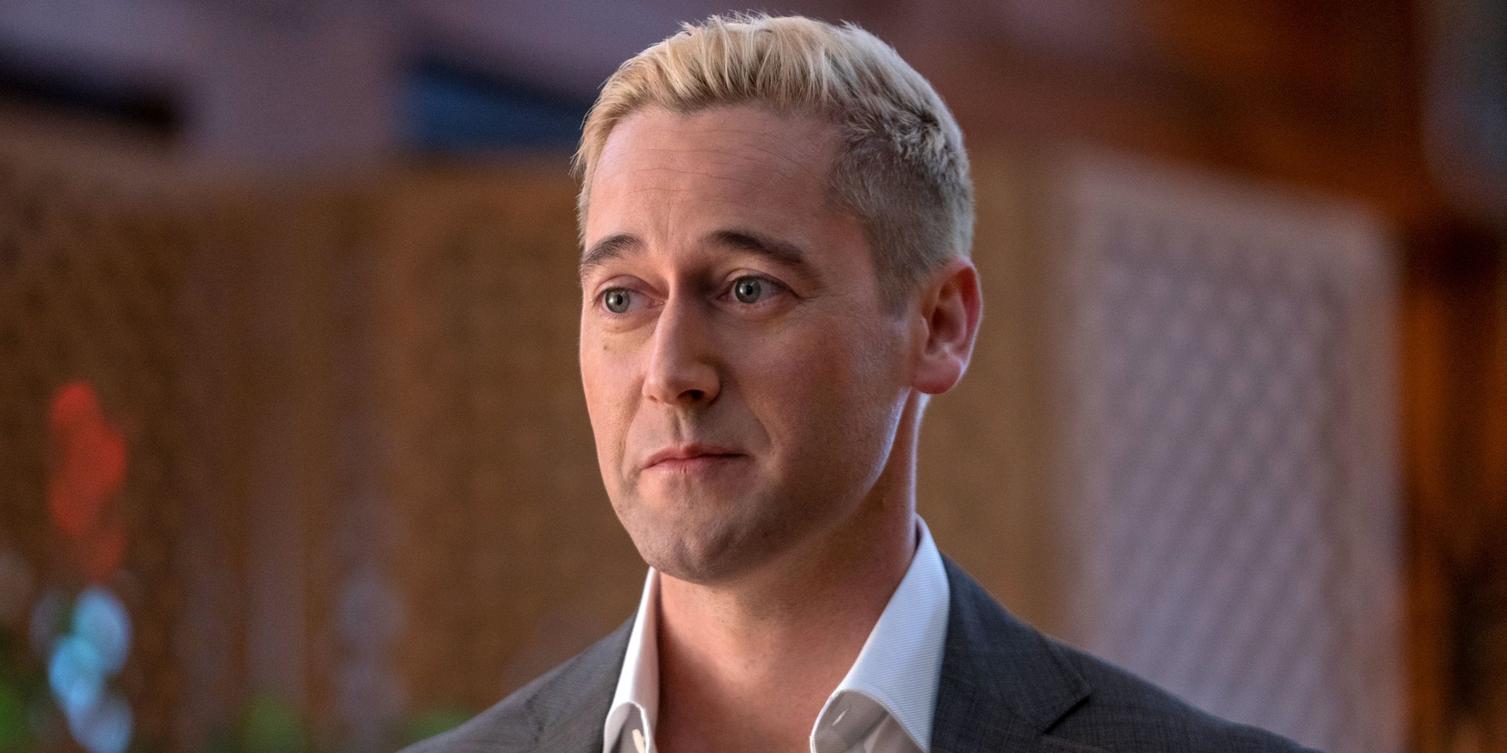 Ryan Eggold as Ed Ramsey smirking with blond hair in Cross