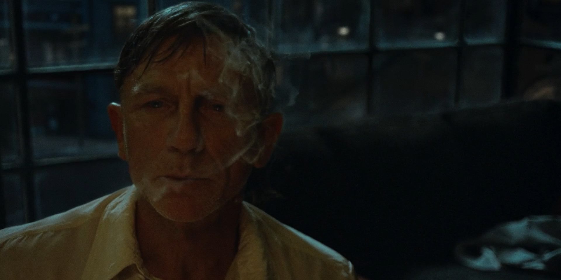 Daniel Craig smokes and looks on solemnly in Luca Guadagnino&rsquo;s &lsquo;Queer&rsquo;
