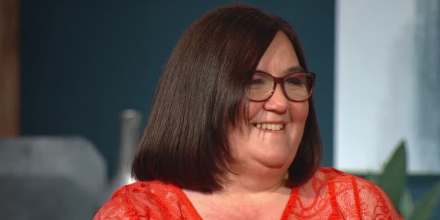 Danielle Mullins smiles and looks at something off camera in 90 Day Fiancé.