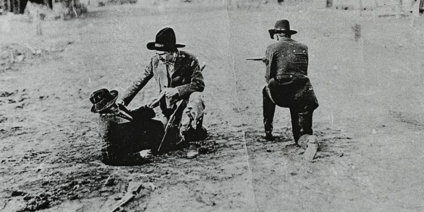 Henry Starr is wounded on the ground during the robbery in 'A Debtor to the Law'