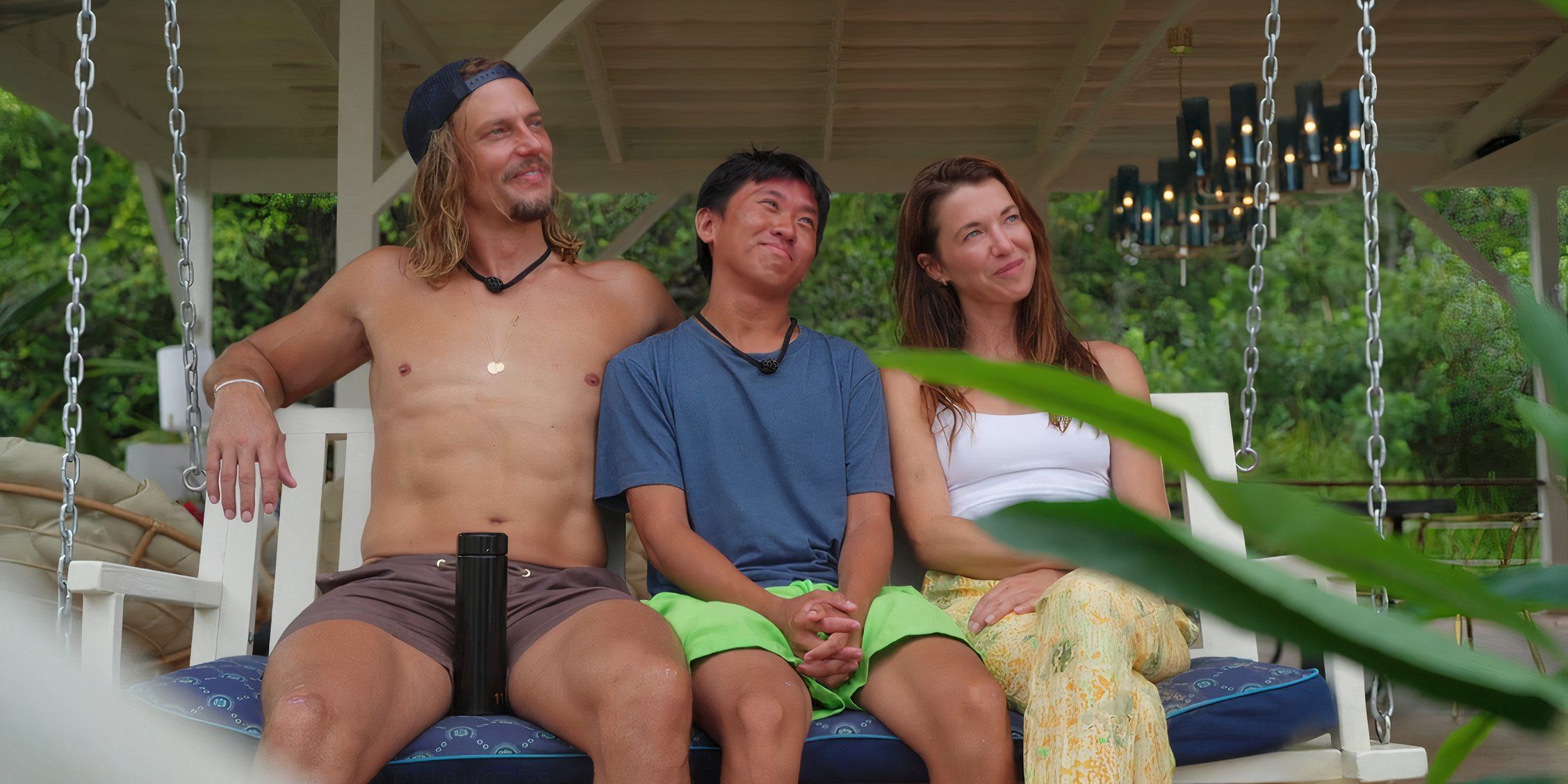 Dickson Wong, David Genat and Parvati Shallow sit together on a bench on Deal or No Deal Island