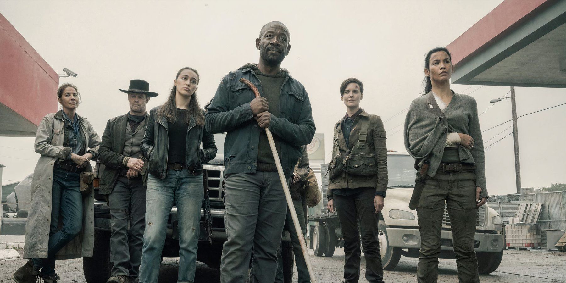 The cast of Fear of The Walking Dead Series staring forward and standing with intimidation.