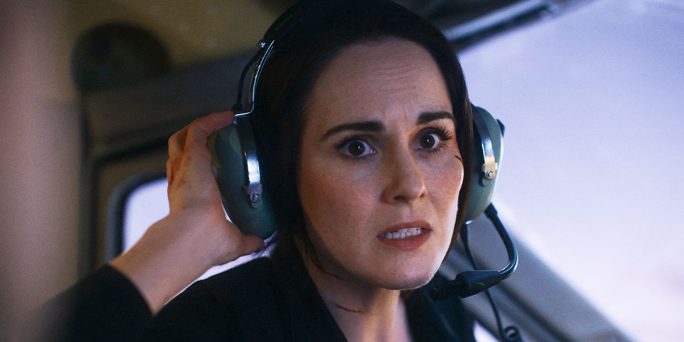 Madolyn (Michelle Dockery) with a headset on looking alarmed in Flight Risk