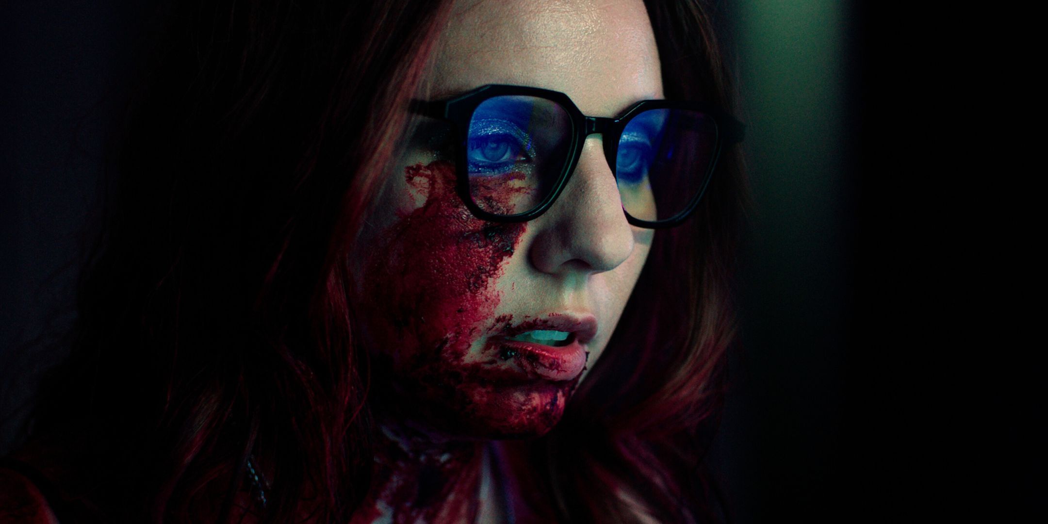 Nicole Pastor as Katie wearing glasses on the phone in Freelance horror