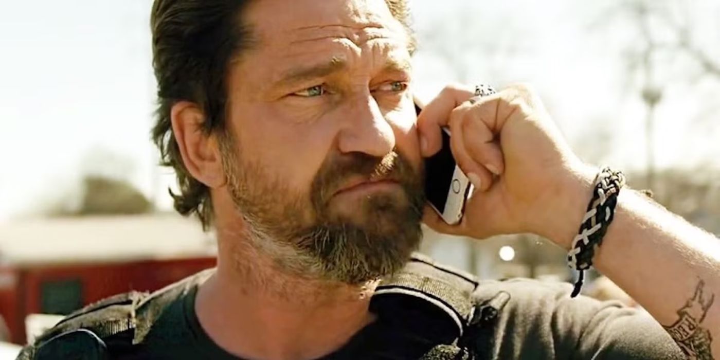 Gerard Butler on the phone in Den of Thieves (2018).