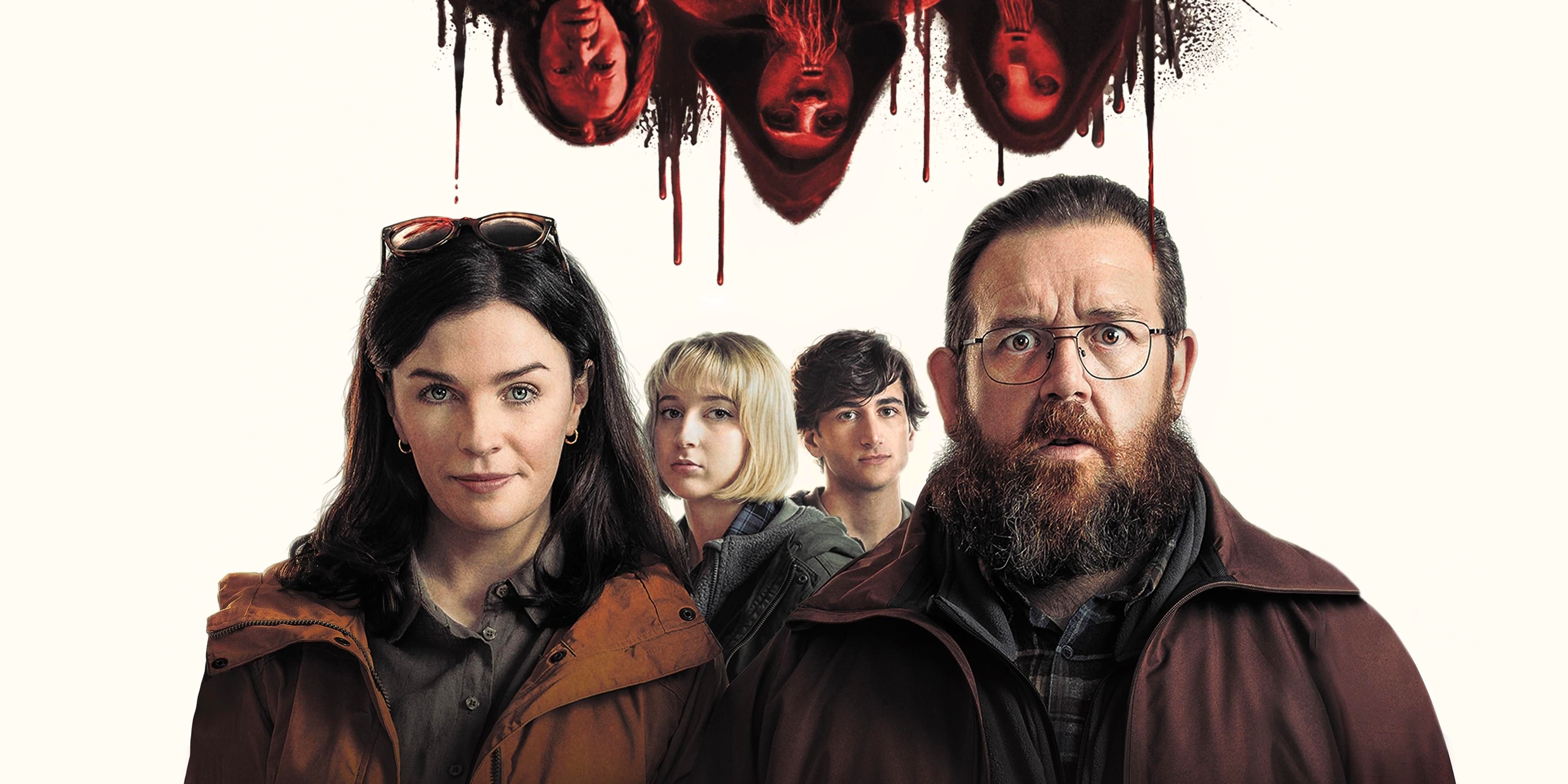 Richard, Susan, Sam and Jessie, played by Nick Frost, Aisling Bea, Sebastian Croft and Maisie Ayres standing under the blood-dripping figures of three creatures.