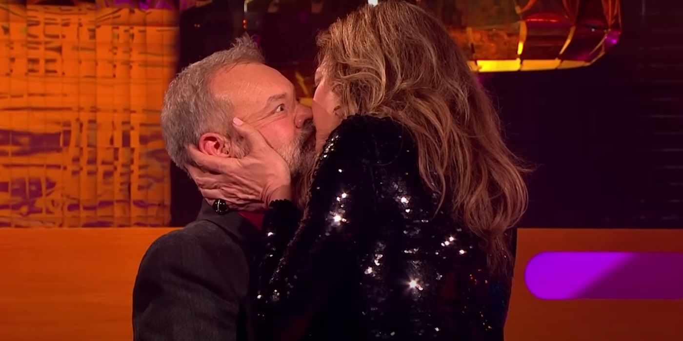 Graham Norton being kissed on the lips by Allison Janney on The Graham Norton Show.