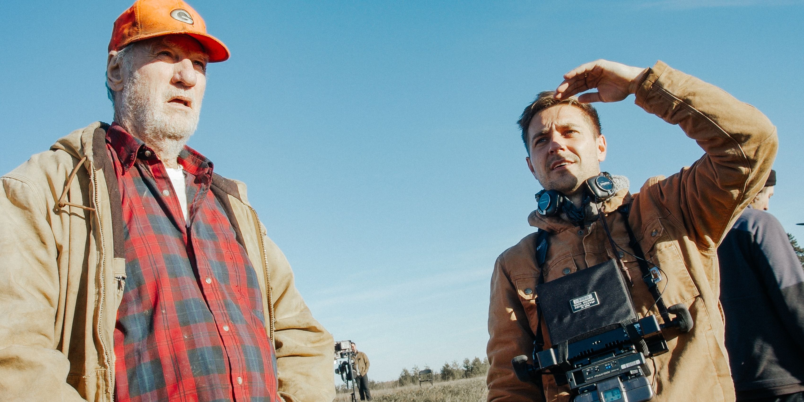 Craig T. Nelson and director Anders Lindwall stand out in a field on the set of Green and Gold.