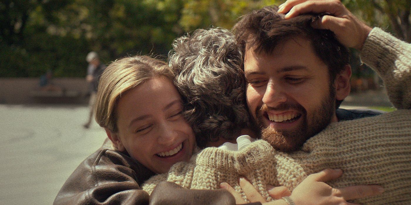 Harper (Lili Reinheart) and Hal (Cooper Raiff) hug their father played by Mark Ruffalo in Hal & Harper