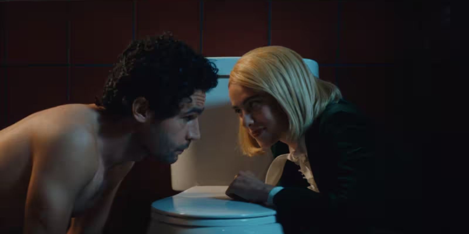 Hal (Christopher Abbott) and Rebecca (Margaret Qualley) staring at each other in &lsquo;Sanctuary&rsquo;