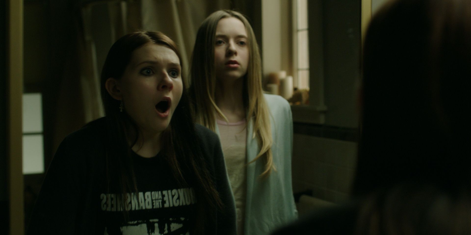 Abigail Breslin as Lisa sees a girl in the mirror in Haunter