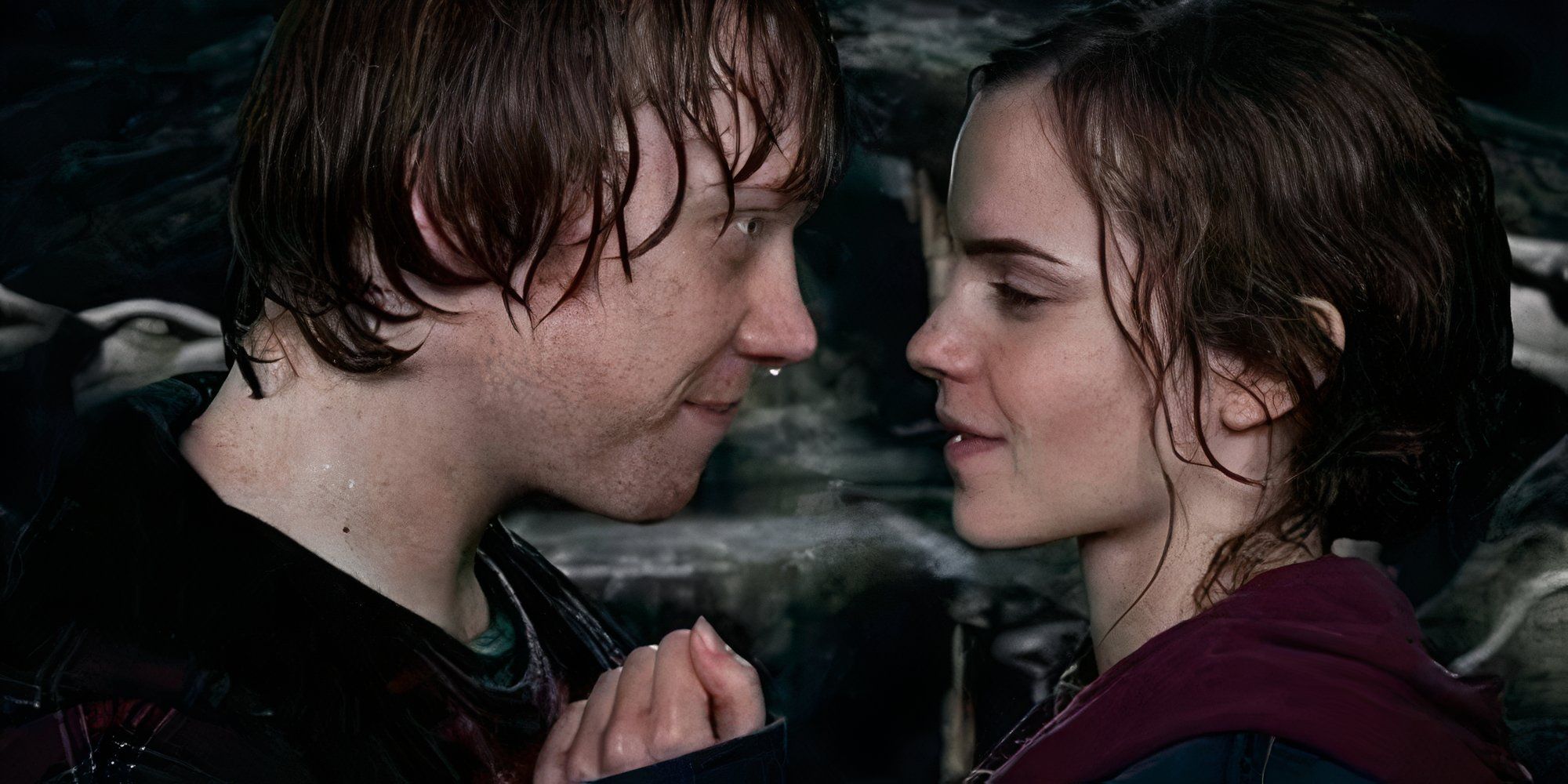 Hermione and Ron look at each other in Deathly Hallows Part 1 after kissing