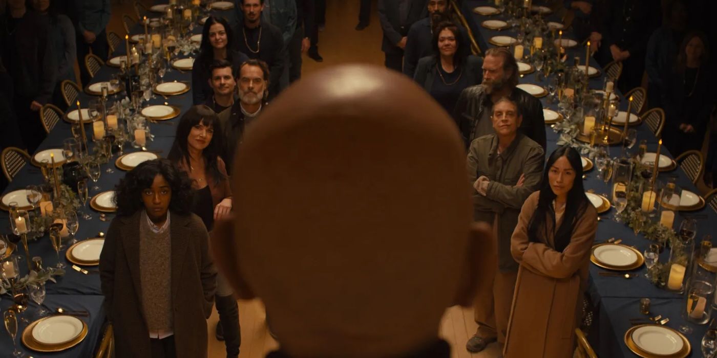 John Malkovich as Alfred Moretti in Opus with his followers in Opus