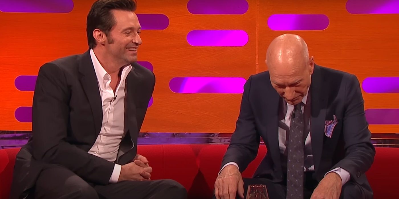 Hugh Jackman looking at Patrick Stewart as they sit next to each other on the couch on The Graham Norton Show.