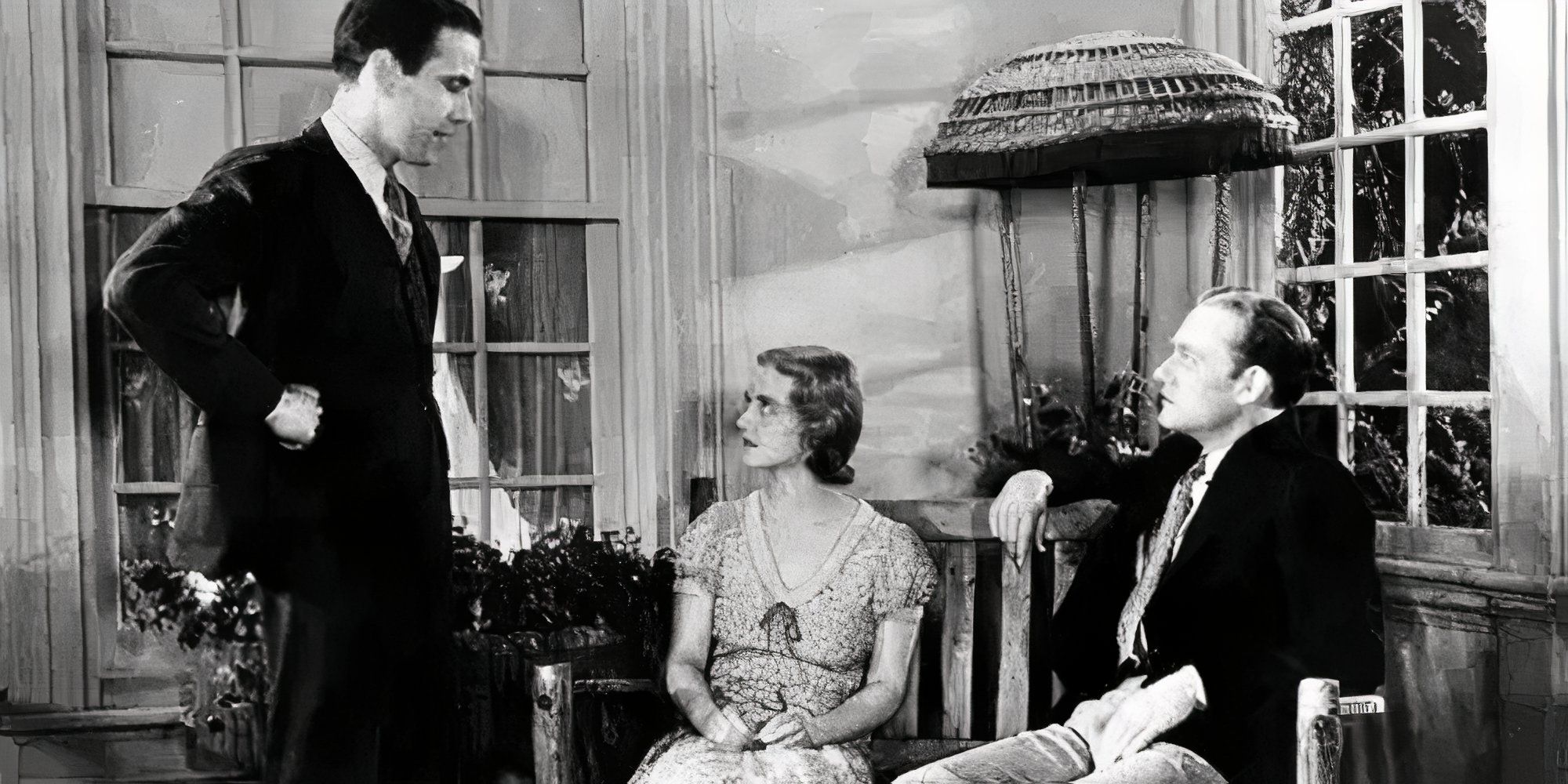 Humphrey Bogart standing in front of Bette Davis and Conrad Nagel in Bad Sister (1931)