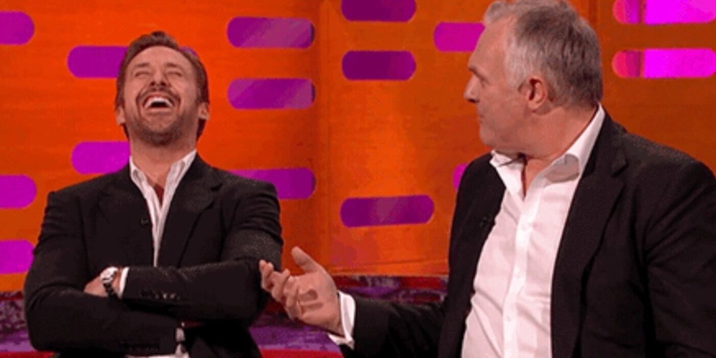 Ryan Gosling laughing as Greg Davies tells a story on The Graham Norton Show.