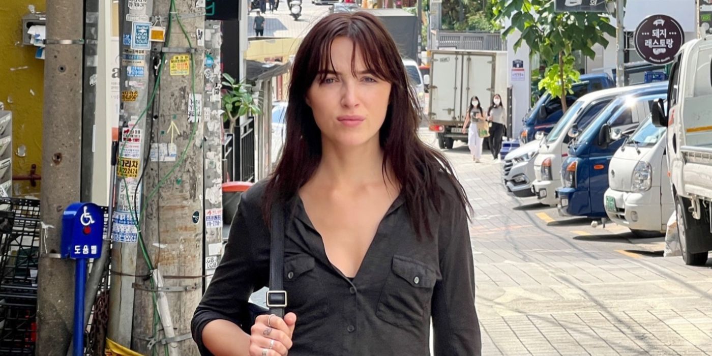 Phoebe Dynevor as Maya, wearing a black shirt and facing the camera in Inheritance