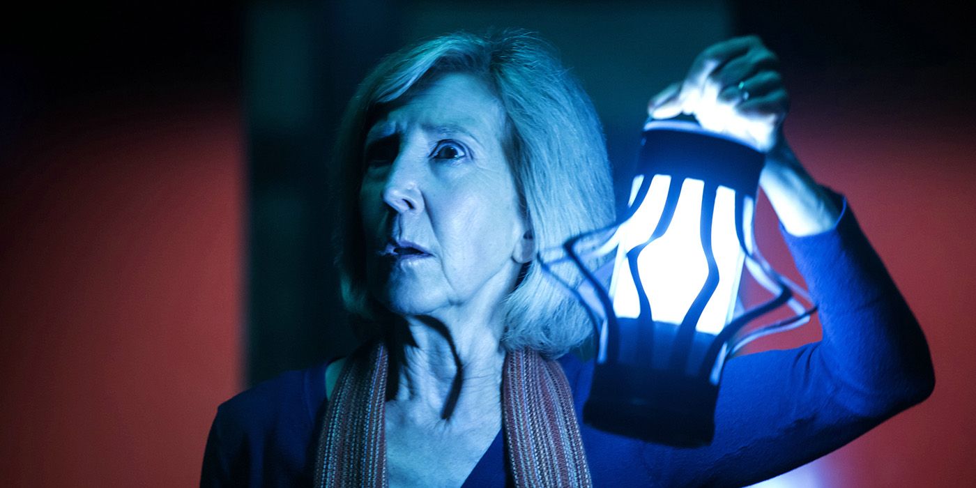 Lin Shaye holding a lantern in Insidious Chapter 3