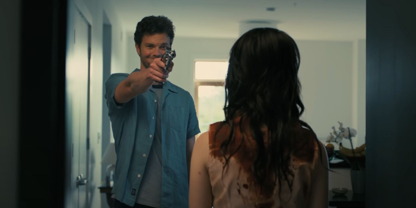 Jack Quaid as Josh pointing a gun at Sophie Thatcher&rsquo;s Iris in Companion.