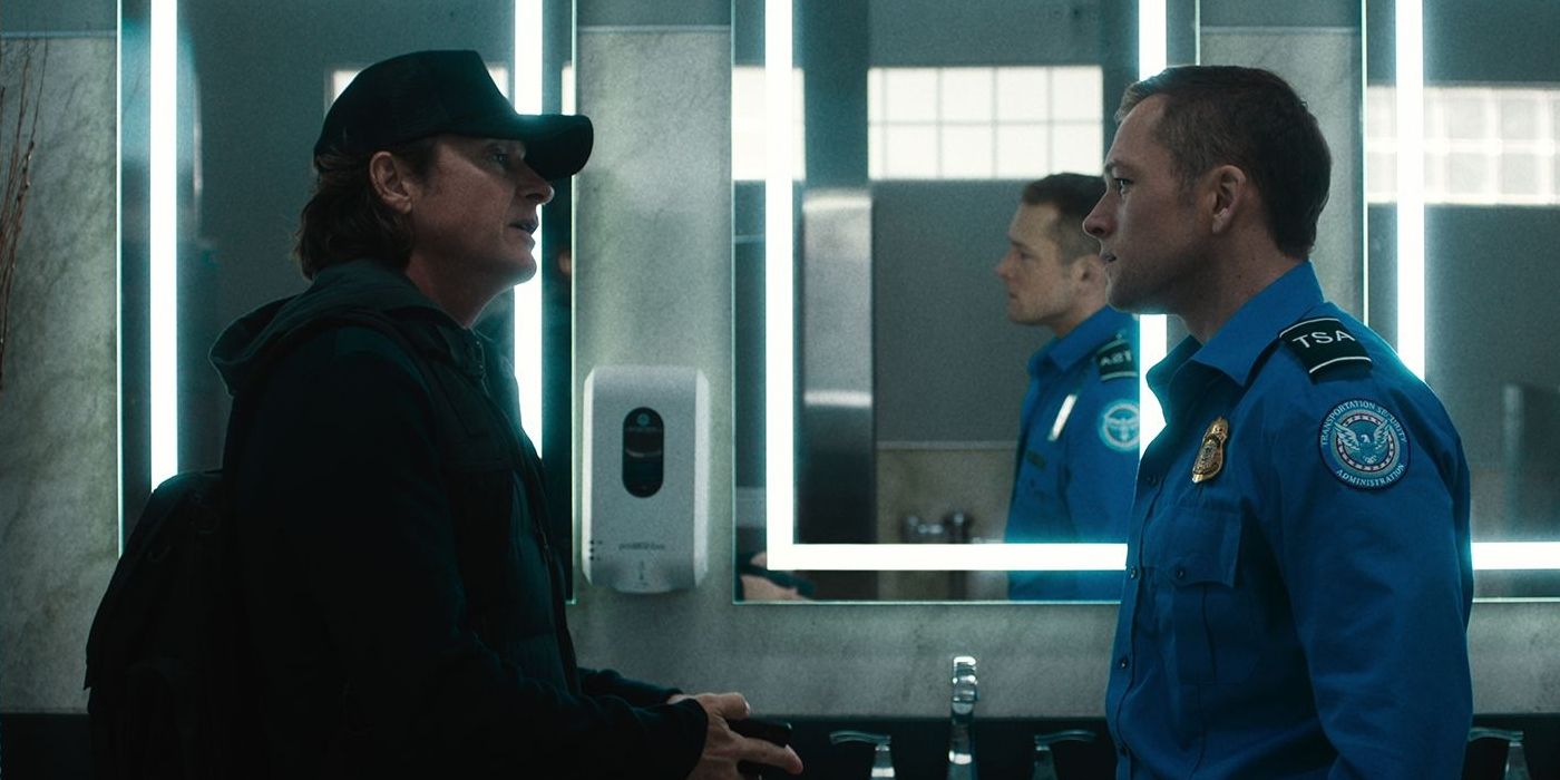 Jason Bateman talking to Taron Egerton in a bathroom in Carry-On movie