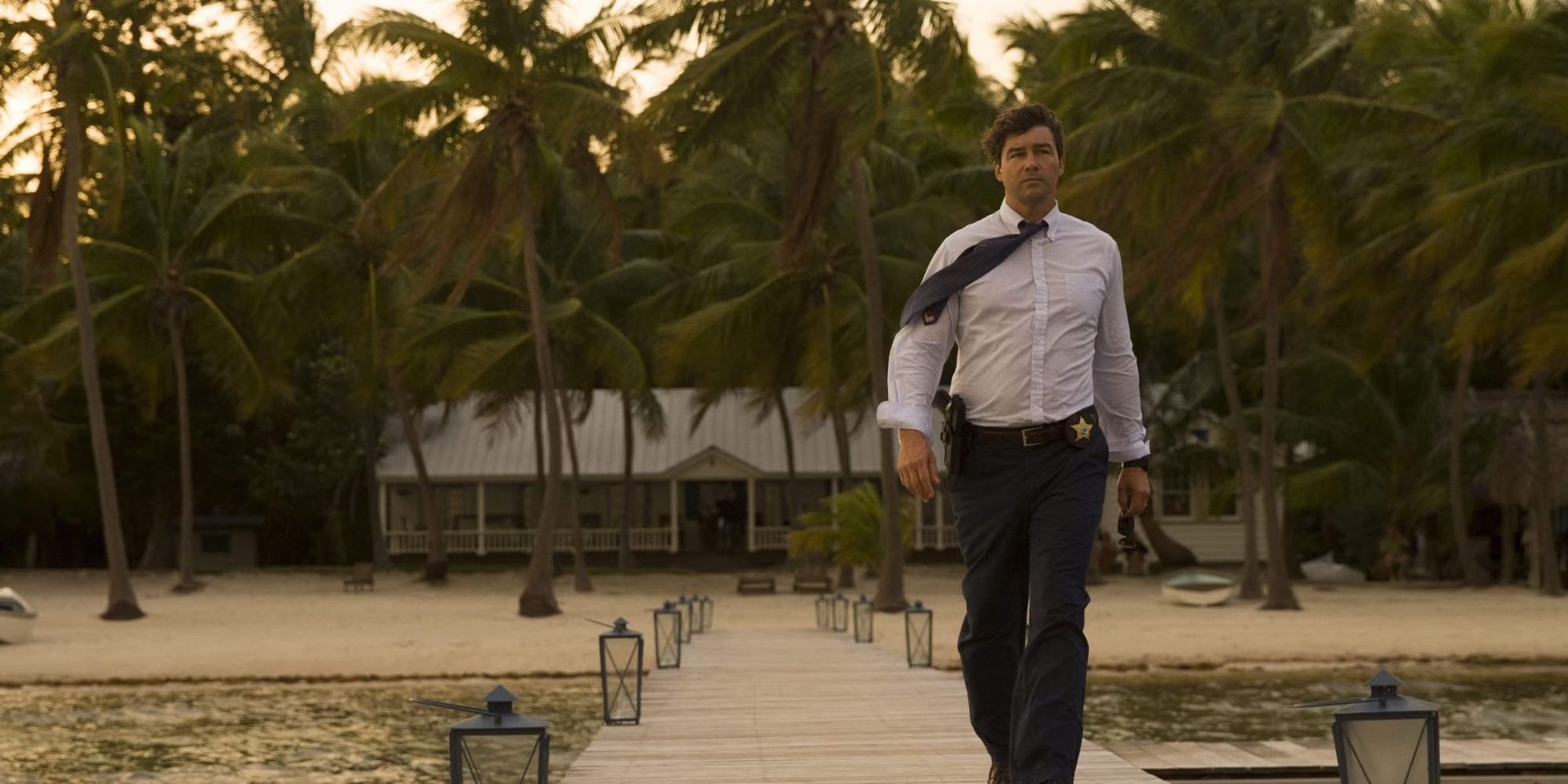 John Rayburn walks down a dock in Bloodline.