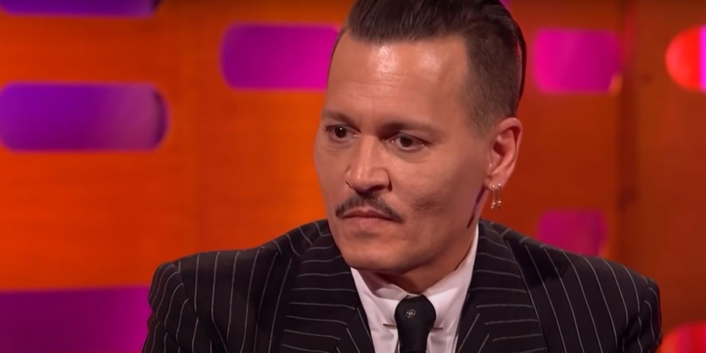 Johnny Depp looks uncomfortable sitting on the couch on 'The Graham Norton Show'.