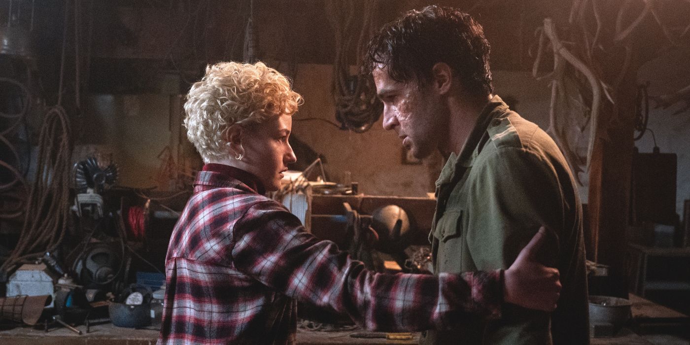 A concerned Julia Garner as Charlotte grabbing a disheveled Christopher Abbott as Blake's shoulder in Wolf Man.