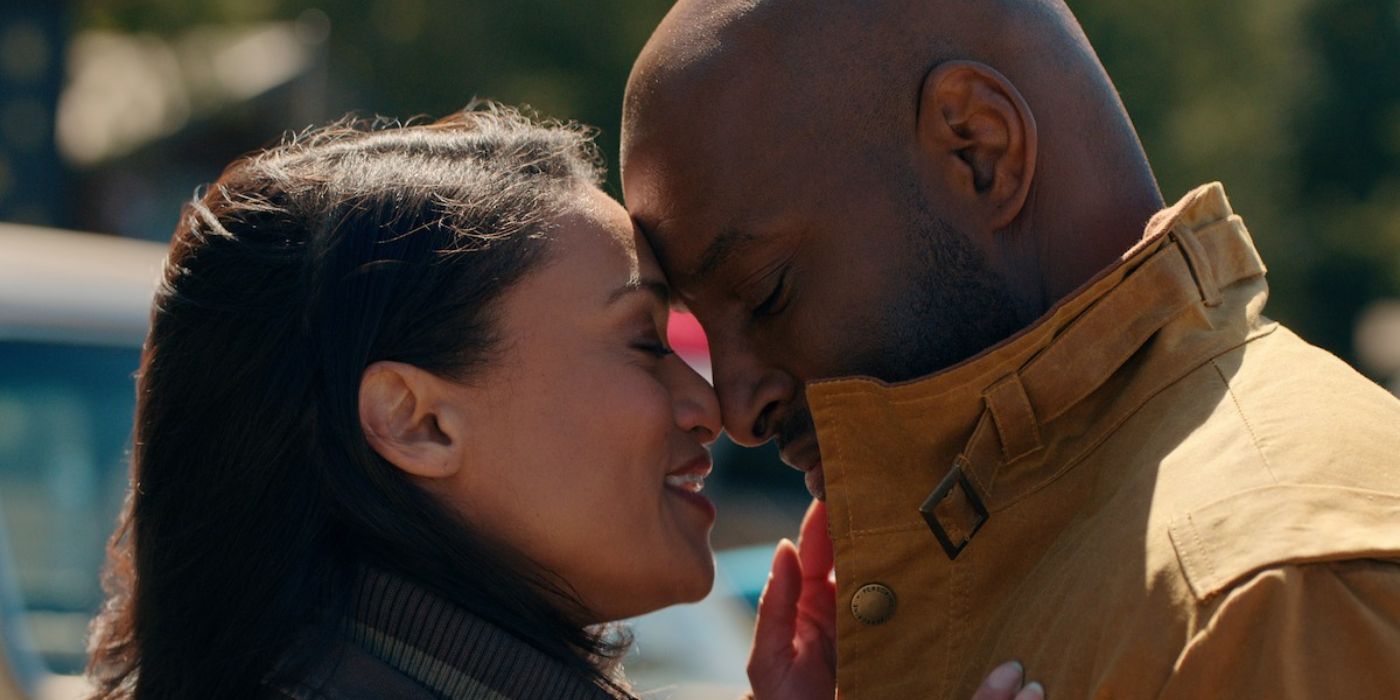 Kaia and Preacher shown up close while they're cuddling outside and smiling in 'Virgin River'