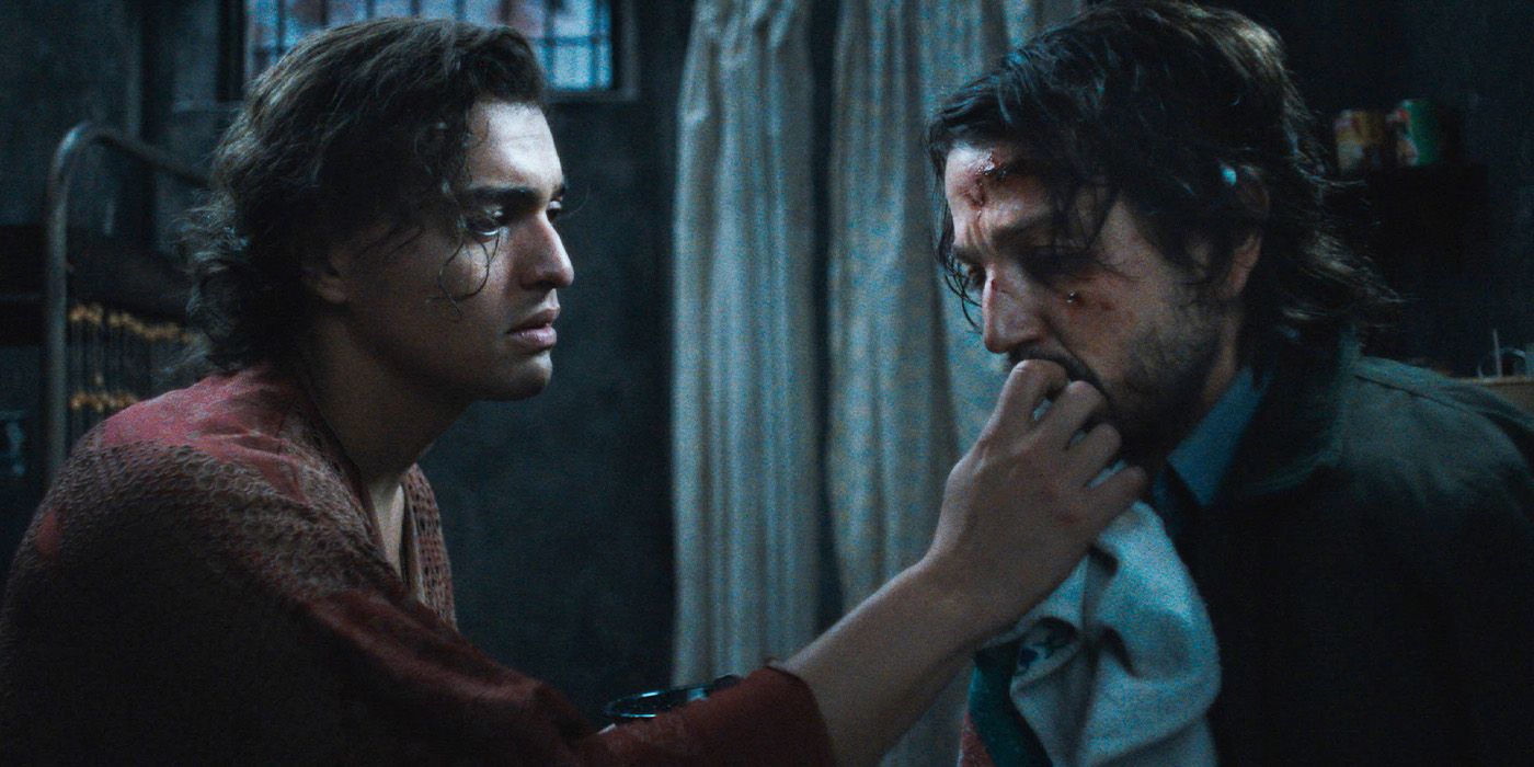 Luis (Tonatiuh) mending Valentin's (Diego Luna) wounds in Kiss of the Spider Woman