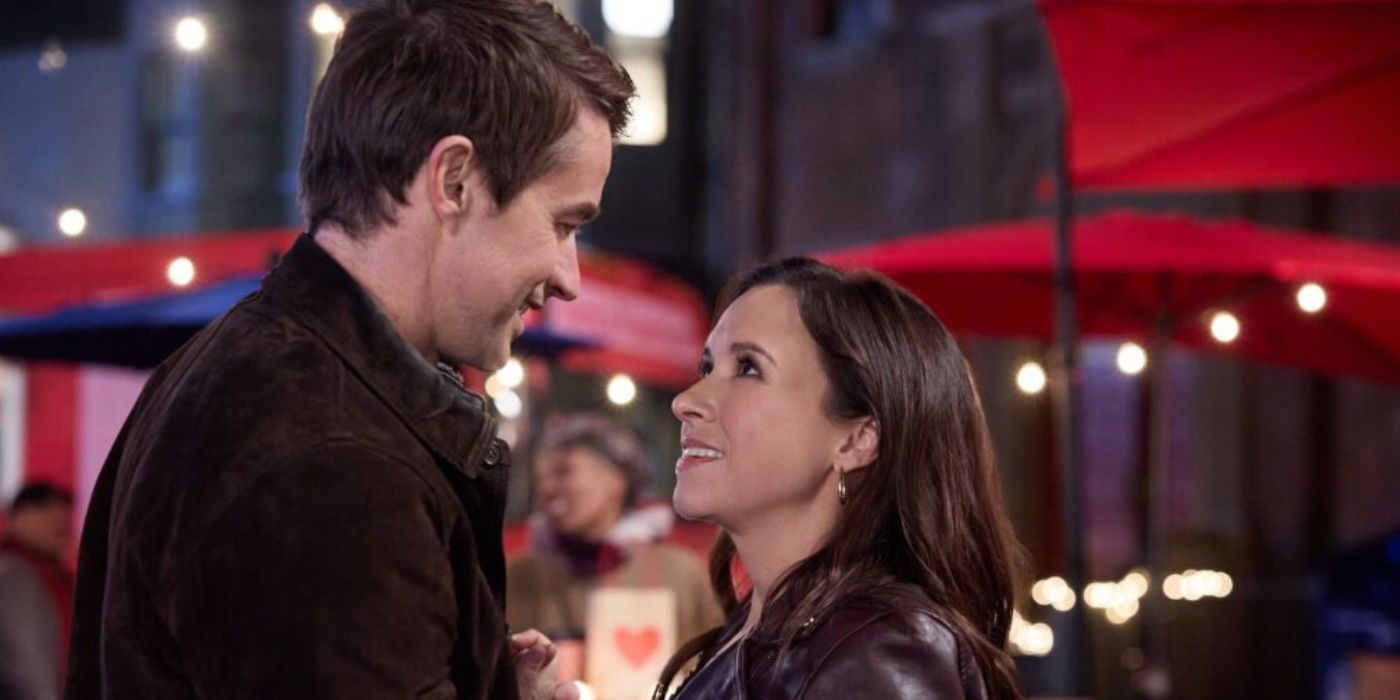 Lacey Chabert and Robert Buckley looking at each other in 'An Unexpected Valentine'.