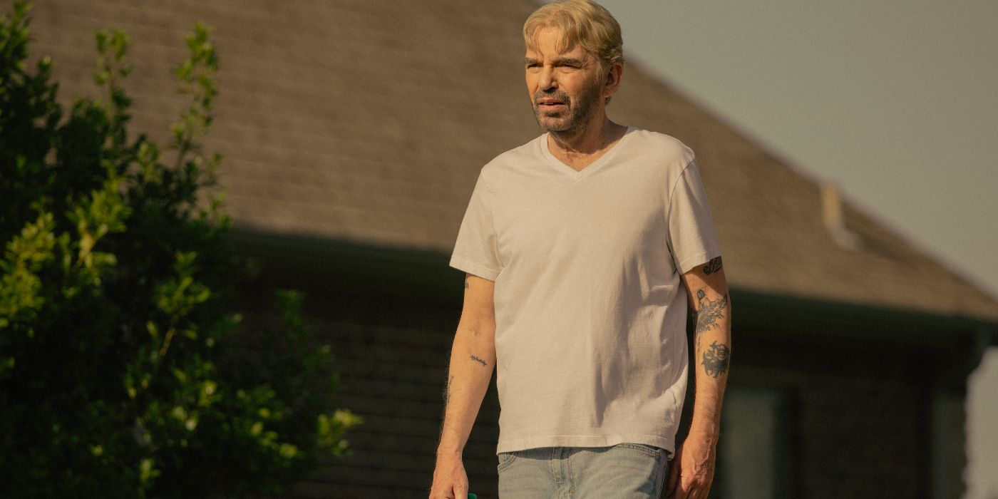 Billy Bob Thornton standing in a yard in Landman Episode 9.