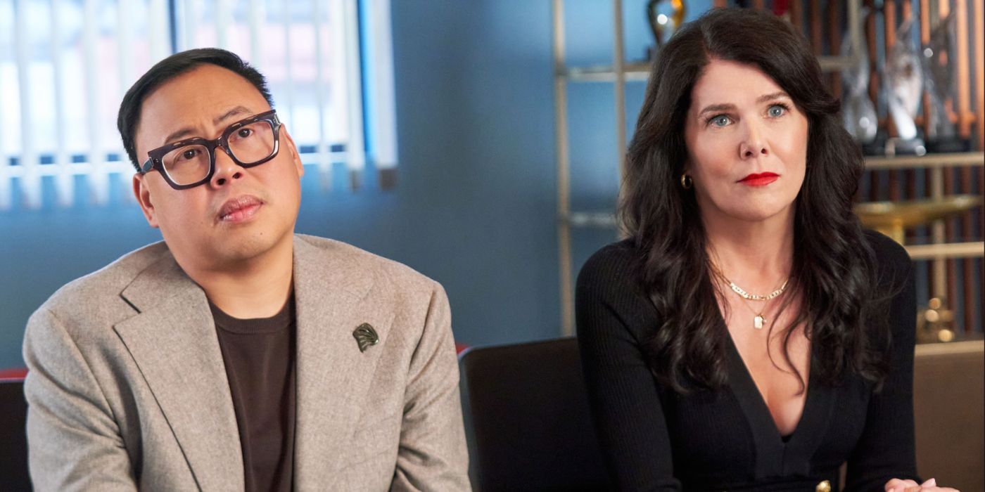 Nico Santos and Lauren Graham sitting together in 'The Z-Suite'.