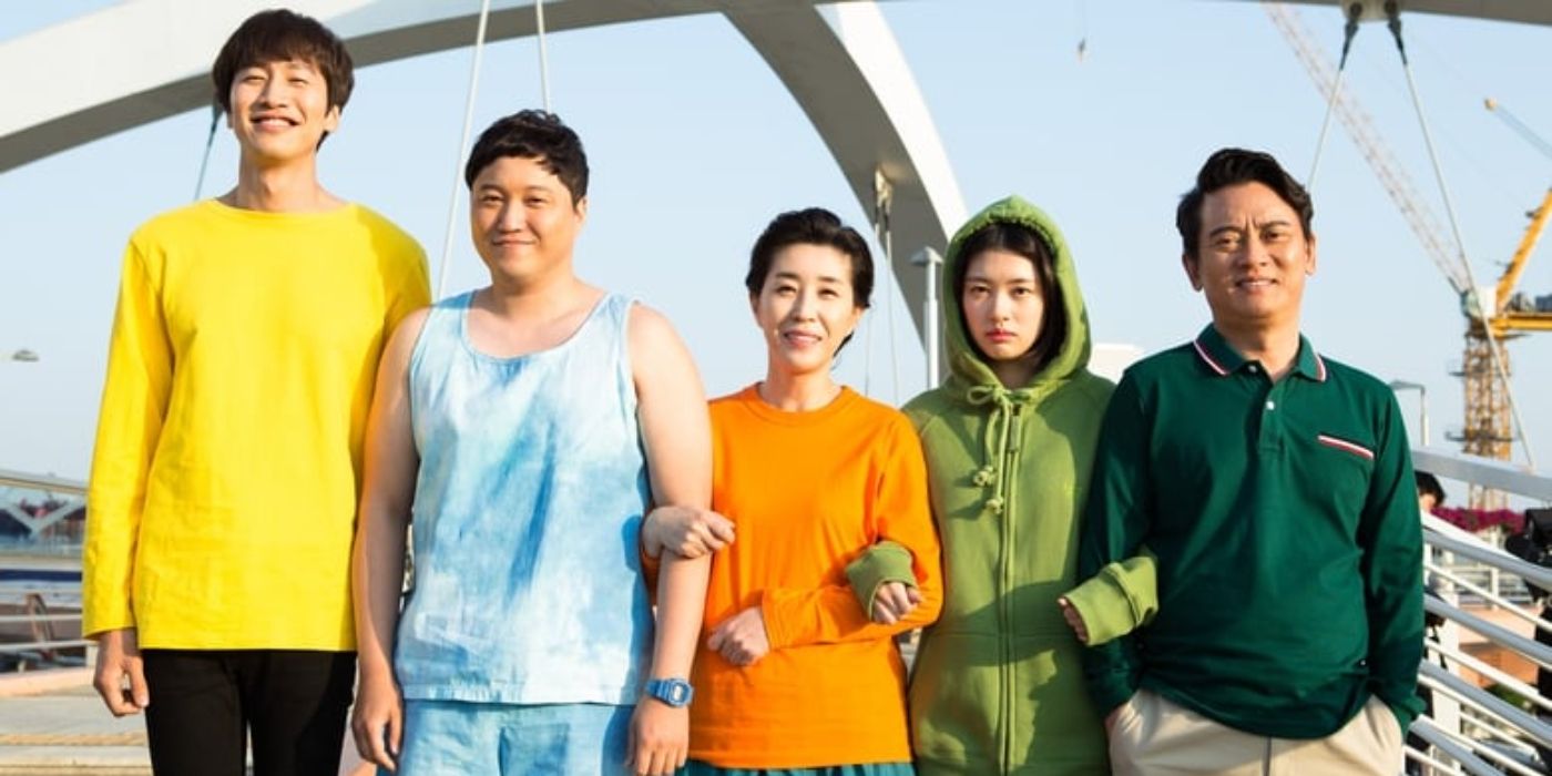 Five people pose for a picture with four of them smiling and one girl frowning in The Sound of Your Heart.