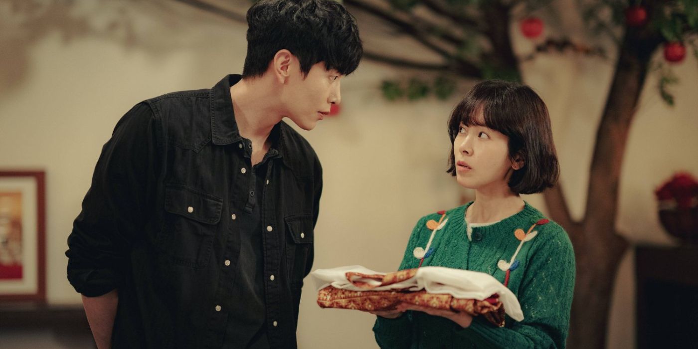 Lee Min-ki and Han Ji-min look at each other with some tension between them in Behind Your Touch.