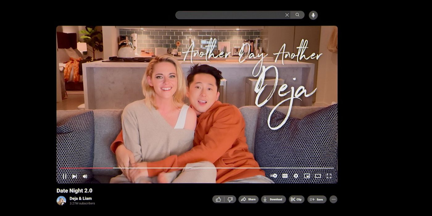 Me/Deja (Kristen Stewart) and Iam/Liam (Steven Yeun) hugging on a couch on YouTube in Love Me