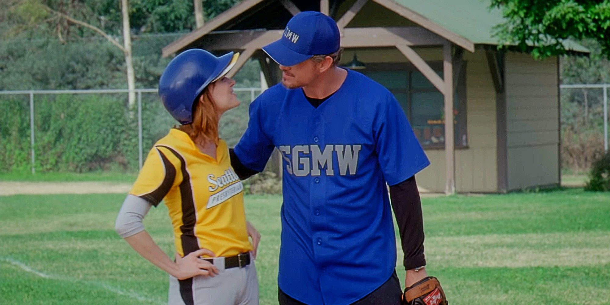 Julia and Mark smiling at each other while playing baseball in Grey&rsquo;s Anatomy Season 8.