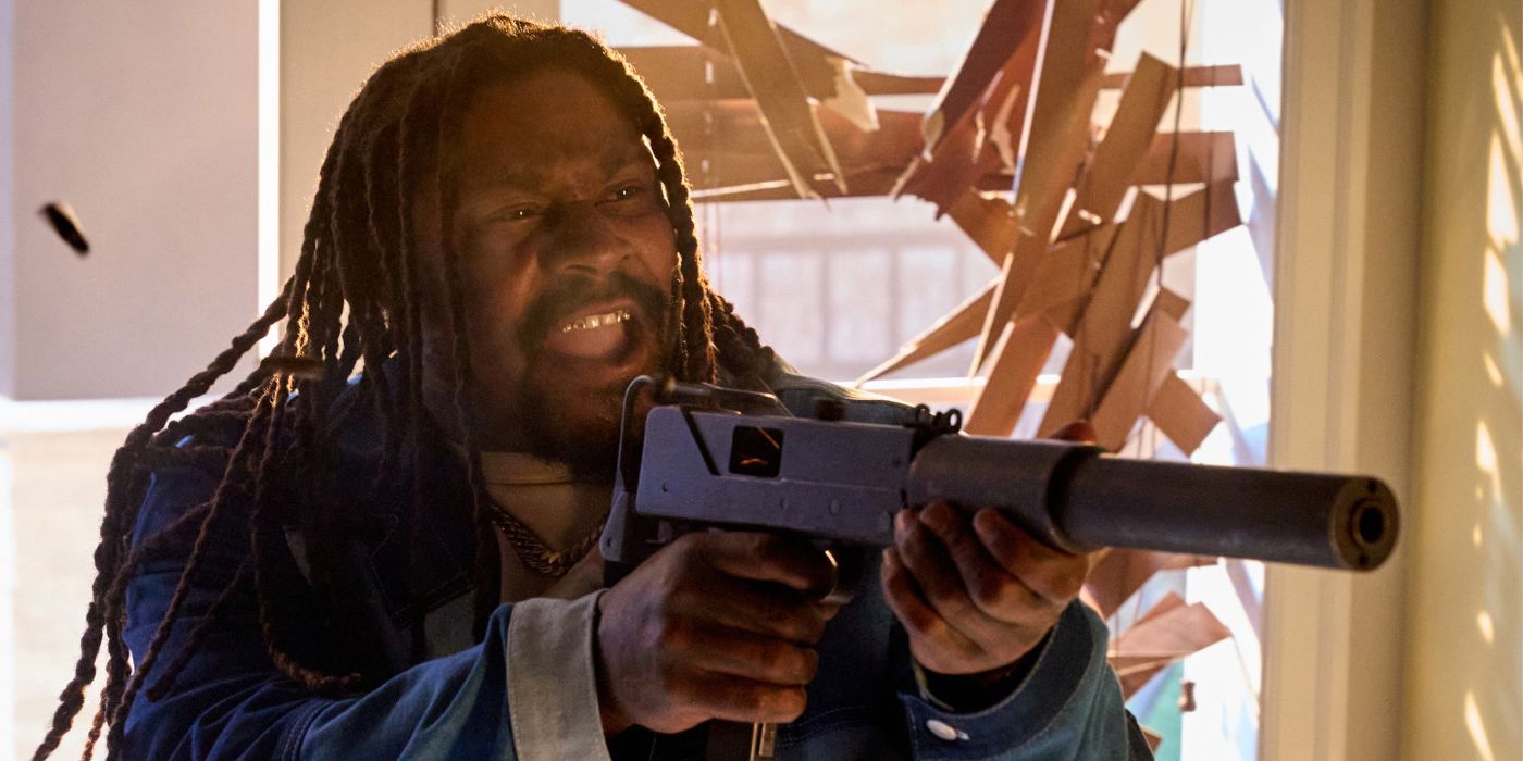Marshawn Lynch wielding an assault rifle as King in Love Hurts.